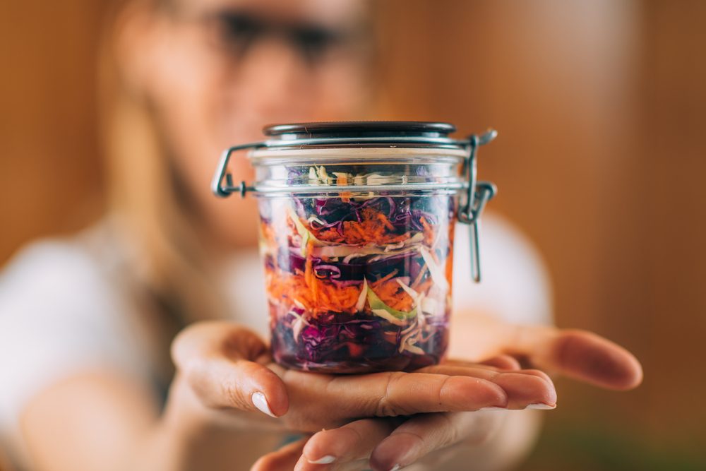 Vegetable,Fermentation.,Woman,Holding,Jar,With,Fermented,Vegetables.